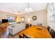 Bright dining area with wood table and access to living room at 3520 Calabria Ave # 3520, Davenport, FL 33897