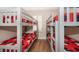 Bunk beds in a cheery bedroom with Mickey Mouse bedding and wood flooring at 3520 Calabria Ave # 3520, Davenport, FL 33897