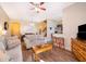 Spacious living room with comfortable seating, a coffee table, and large TV at 3520 Calabria Ave # 3520, Davenport, FL 33897