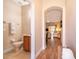 Light and airy entryway with a view into the living area and a half bathroom at 3520 Calabria Ave # 3520, Davenport, FL 33897