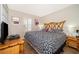 King-size bed in a serene bedroom with bamboo headboard and wood floors at 3520 Calabria Ave # 3520, Davenport, FL 33897