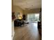 Bright living room with access to balcony and hardwood floors at 6462 Cantua Ln # 105, Orlando, FL 32835