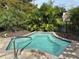 Community hot tub with surrounding landscaping at 6462 Cantua Ln # 105, Orlando, FL 32835