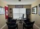 Home office with a large desk and two chairs at 6462 Cantua Ln # 105, Orlando, FL 32835