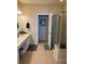 Large bathroom with double vanity, shower, and plenty of counter space at 6462 Cantua Ln # 105, Orlando, FL 32835