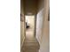 Bright hallway with light neutral walls and hardwood floors at 6462 Cantua Ln # 105, Orlando, FL 32835