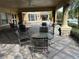 Community patio with shaded seating area at 6462 Cantua Ln # 105, Orlando, FL 32835