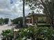 Relaxing pool area with gazebo and seating at 6462 Cantua Ln # 105, Orlando, FL 32835