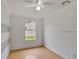 Simple bedroom with laminate floors and a window offering natural light at 1053 E Hancock Dr, Deltona, FL 32725