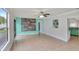 Spacious bedroom with tile flooring, a ceiling fan, and access to kitchen at 1053 E Hancock Dr, Deltona, FL 32725