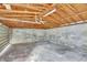 Unfinished garage interior with exposed beams and concrete floor at 1053 E Hancock Dr, Deltona, FL 32725