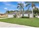 House exterior featuring a garage and landscaping at 1053 E Hancock Dr, Deltona, FL 32725