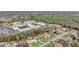 Aerial view showcasing a house's setting near a school and other homes at 1053 E Hancock Dr, Deltona, FL 32725