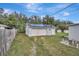 Detached garage with solar panels and grassy yard at 1053 E Hancock Dr, Deltona, FL 32725