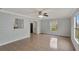 Bright bedroom with tile floors and a view of the backyard at 1053 E Hancock Dr, Deltona, FL 32725