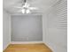 Empty spare bedroom with wood floors and ceiling fan, ready for your personal touch at 1053 E Hancock Dr, Deltona, FL 32725