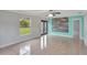 Large bedroom with tile floors, ceiling fan, and backyard access at 1053 E Hancock Dr, Deltona, FL 32725