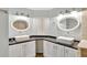 Updated bathroom with double vanity, oval mirrors, and a large shower at 1053 E Hancock Dr, Deltona, FL 32725