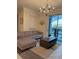Living room with sectional sofa, coffee table, and pool view at 1144 Challenge Dr, Davenport, FL 33896