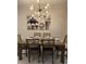 Bright dining room with modern chandelier and wall art at 1144 Challenge Dr, Davenport, FL 33896