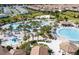 Aerial view of community pool and surrounding homes at 1144 Challenge Dr, Davenport, FL 33896