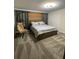 Spacious bedroom with gray carpet and a modern bed at 1144 Challenge Dr, Davenport, FL 33896