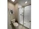 Small bathroom with a shower and white tile at 1144 Challenge Dr, Davenport, FL 33896
