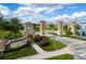Community entrance with signage and landscaping at 1144 Challenge Dr, Davenport, FL 33896