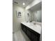 Bathroom with double vanity and white tile floor at 1144 Challenge Dr, Davenport, FL 33896