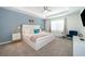 Bright bedroom featuring a king-size bed and sitting area at 1812 Tropical Palms Cir, Kissimmee, FL 34747
