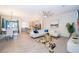 Open-concept living and dining area with modern furniture and tile floors at 1812 Tropical Palms Cir, Kissimmee, FL 34747