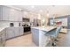 Modern kitchen with gray cabinets and a large island at 1812 Tropical Palms Cir, Kissimmee, FL 34747