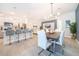 Open concept dining area with modern table and chairs, adjacent to kitchen at 1812 Tropical Palms Cir, Kissimmee, FL 34747