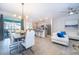Open concept kitchen and living area with modern appliances at 1812 Tropical Palms Cir, Kissimmee, FL 34747