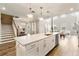 Modern kitchen with white cabinets, quartz countertops, and island at 2094 Derwent Dr, Davenport, FL 33896