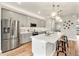 Contemporary kitchen featuring gray cabinets and stainless steel appliances at 2094 Derwent Dr, Davenport, FL 33896
