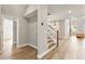 Bright entryway with hardwood floors and staircase at 2094 Derwent Dr, Davenport, FL 33896