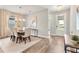 Elegant dining room with hardwood floors, chandelier, and access to foyer at 2094 Derwent Dr, Davenport, FL 33896