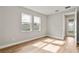 Well-lit bedroom with hardwood floors and backyard access at 2094 Derwent Dr, Davenport, FL 33896