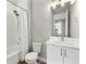 Clean bathroom with white vanity and shower/tub combo at 2094 Derwent Dr, Davenport, FL 33896