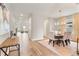 Bright dining room with hardwood floors and chandelier at 2094 Derwent Dr, Davenport, FL 33896