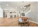 Open dining area with hardwood floors and kitchen view at 2094 Derwent Dr, Davenport, FL 33896