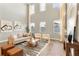 Spacious living room with high ceilings and large windows at 2094 Derwent Dr, Davenport, FL 33896