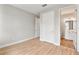 Spacious bedroom with wood-look flooring and en-suite bathroom at 2094 Derwent Dr, Davenport, FL 33896