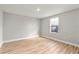 Simple bedroom with wood flooring and a window at 2094 Derwent Dr, Davenport, FL 33896