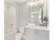 Clean bathroom with a shower/tub combo and gray vanity at 2094 Derwent Dr, Davenport, FL 33896