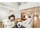 Open-concept living room with adjacent kitchen and high ceilings at 2094 Derwent Dr, Davenport, FL 33896