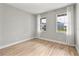 Spacious bedroom with hardwood floors and two windows at 2094 Derwent Dr, Davenport, FL 33896
