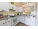 Kitchen with white cabinets, gray countertops and modern appliances at 2691 Winchester Cir, Eustis, FL 32726