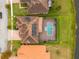 Aerial view showcasing home with solar panels and pool at 2760 Rialto Ct, Kissimmee, FL 34746